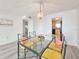 Charming dining area with glass table and kitchen access at 3606 S Peninsula Dr # 404, Port Orange, FL 32127
