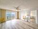 Living room with water view and access to balcony at 3606 S Peninsula Dr # 404, Port Orange, FL 32127