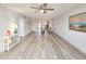 Bright living room features hardwood floors and a view into the dining area at 3606 S Peninsula Dr # 404, Port Orange, FL 32127