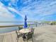Waterfront patio with table and chairs, offering scenic views at 3606 S Peninsula Dr # 404, Port Orange, FL 32127