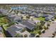 Aerial view of community with lake, houses, and palm trees at 383 Leoni St, New Smyrna Beach, FL 32168