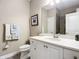 Clean bathroom with white vanity and a walk-in shower at 383 Leoni St, New Smyrna Beach, FL 32168