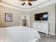 Main bedroom with white dresser and en-suite bathroom at 383 Leoni St, New Smyrna Beach, FL 32168