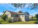 Back of house with fenced yard and landscaping at 40 Sandra Cir, New Smyrna Beach, FL 32168