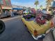 Yellow classic MG convertible with champagne at 40 Sandra Cir, New Smyrna Beach, FL 32168