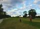 Two women playing golf on a sunny day at 40 Sandra Cir, New Smyrna Beach, FL 32168