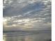 Beachfront property with scenic ocean view and sunlit sky at 40 Sandra Cir, New Smyrna Beach, FL 32168
