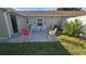Brick paved patio with seating area and lush greenery at 40 Sandra Cir, New Smyrna Beach, FL 32168