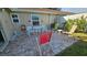 Outdoor patio with brick pavers and comfortable seating area at 40 Sandra Cir, New Smyrna Beach, FL 32168