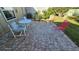 Cozy patio with brick pavers, seating area, and a small lawn at 40 Sandra Cir, New Smyrna Beach, FL 32168