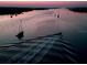 Aerial view of waterway at sunset with boats at 40 Sandra Cir, New Smyrna Beach, FL 32168