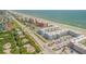 Aerial showing beachfront community, ocean views, and surrounding buildings at 4151 S Atlantic Ave # 112, New Smyrna Beach, FL 32169