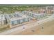 Aerial view of oceanfront community, showing beach and pool at 4151 S Atlantic Ave # 112, New Smyrna Beach, FL 32169