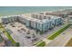 Aerial view of the oceanfront community with ample parking at 4151 S Atlantic Ave # 112, New Smyrna Beach, FL 32169