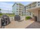 Outdoor grilling area with two grills at 4151 S Atlantic Ave # 112, New Smyrna Beach, FL 32169