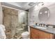 Modern bathroom with a walk-in shower and updated vanity at 4151 S Atlantic Ave # 112, New Smyrna Beach, FL 32169