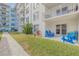 Ground level condo with private patio and walkway to the building at 4151 S Atlantic Ave # 112, New Smyrna Beach, FL 32169