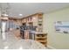 Modern kitchen with stainless steel appliances and light wood cabinets at 4151 S Atlantic Ave # 112, New Smyrna Beach, FL 32169