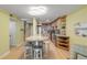 Open concept kitchen with granite counters and breakfast bar at 4151 S Atlantic Ave # 112, New Smyrna Beach, FL 32169