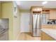 Kitchen features stainless steel appliances and light wood cabinets at 4151 S Atlantic Ave # 112, New Smyrna Beach, FL 32169