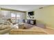 Living room boasts light walls, comfortable seating and patio access at 4151 S Atlantic Ave # 112, New Smyrna Beach, FL 32169