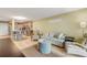 Open concept living room and kitchen with comfortable seating at 4151 S Atlantic Ave # 112, New Smyrna Beach, FL 32169