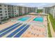 Two pools, shuffleboard, and ample lounge chairs at 4151 S Atlantic Ave # 112, New Smyrna Beach, FL 32169