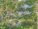 Property surrounded by lush forest with multiple structures at 4155 Budd Rd, New Smyrna Beach, FL 32168