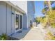 Private backyard with a patio and tropical landscaping at 4278 Sun Village Ct # 27D, New Smyrna Beach, FL 32169