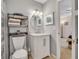 Stylish bathroom with white vanity, marble countertop, and a toilet at 4278 Sun Village Ct # 27D, New Smyrna Beach, FL 32169