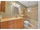 Clean bathroom with light wood vanity, shower/tub combo, and a toilet at 4278 Sun Village Ct # 27D, New Smyrna Beach, FL 32169