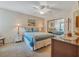 Bedroom with ceiling fan, mirrored closet and nightstands at 4278 Sun Village Ct # 27D, New Smyrna Beach, FL 32169
