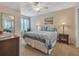 Comfortable bedroom with ceiling fan and mirrored closet doors at 4278 Sun Village Ct # 27D, New Smyrna Beach, FL 32169
