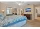 Bedroom with dresser, ceiling fan and access to the bathroom at 4278 Sun Village Ct # 27D, New Smyrna Beach, FL 32169