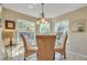 Charming breakfast nook with a glass-top table and four chairs at 4278 Sun Village Ct # 27D, New Smyrna Beach, FL 32169