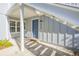 Private condo entrance with a blue door and address number at 4278 Sun Village Ct # 27D, New Smyrna Beach, FL 32169