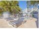 Community hot tub with lounge chairs and surrounding landscaping at 4278 Sun Village Ct # 27D, New Smyrna Beach, FL 32169