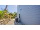 Side of house showing AC units and landscaping at 4278 Sun Village Ct # 27D, New Smyrna Beach, FL 32169