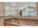 Modern kitchen sink with granite countertop and stainless steel faucet at 4278 Sun Village Ct # 27D, New Smyrna Beach, FL 32169