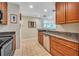 View of kitchen with granite countertops and stainless steel appliances at 4278 Sun Village Ct # 27D, New Smyrna Beach, FL 32169