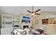 Living room with a fireplace, large TV, and built-in shelving at 4278 Sun Village Ct # 27D, New Smyrna Beach, FL 32169