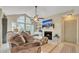 Spacious living room with vaulted ceiling, fireplace and comfortable seating at 4278 Sun Village Ct # 27D, New Smyrna Beach, FL 32169