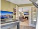 Home office with a view into living room with fireplace at 4278 Sun Village Ct # 27D, New Smyrna Beach, FL 32169