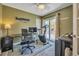 Home office featuring a desk, ergonomic chair, and sliding glass door at 4278 Sun Village Ct # 27D, New Smyrna Beach, FL 32169