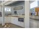 Poolside kitchen with microwave, sink, and countertop at 4278 Sun Village Ct # 27D, New Smyrna Beach, FL 32169