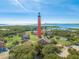Aerial view of Ponce Inlet Lighthouse and surrounding area at 4670 Links Village Dr # C402, Ponce Inlet, FL 32127