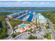 Aerial view showing marina and community pool at 4670 Links Village Dr # C402, Ponce Inlet, FL 32127