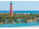 Aerial view of Ponce Inlet Lighthouse and coastline at 4670 Links Village Dr # C402, Ponce Inlet, FL 32127