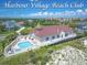 Aerial view of Harbour Village Beach Club, featuring a pool, hot tub, and clubhouse at 4670 Links Village Dr # C402, Ponce Inlet, FL 32127