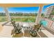 Relaxing balcony with patio furniture overlooking golf course and pool at 4670 Links Village Dr # C402, Ponce Inlet, FL 32127